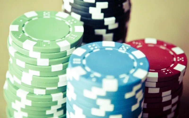 Stacks of green, blue and red casino chips